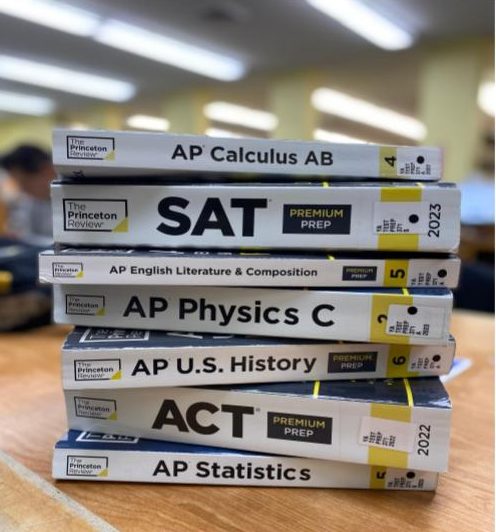 A stack of study prep books. 
